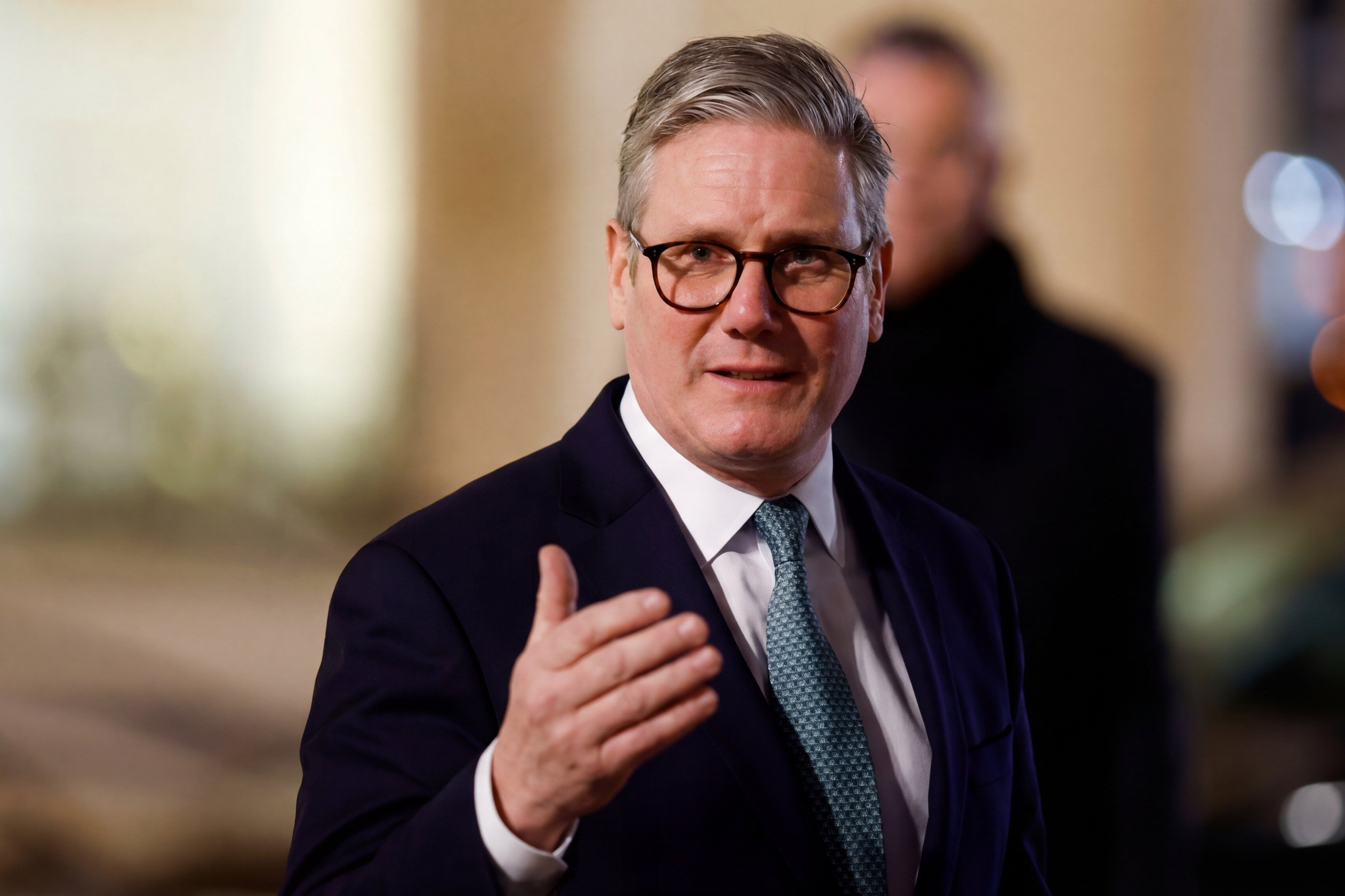 Keir,Starmer,Smiling,In,A,Close-up,Portrait,,Wearing,Glasses,And