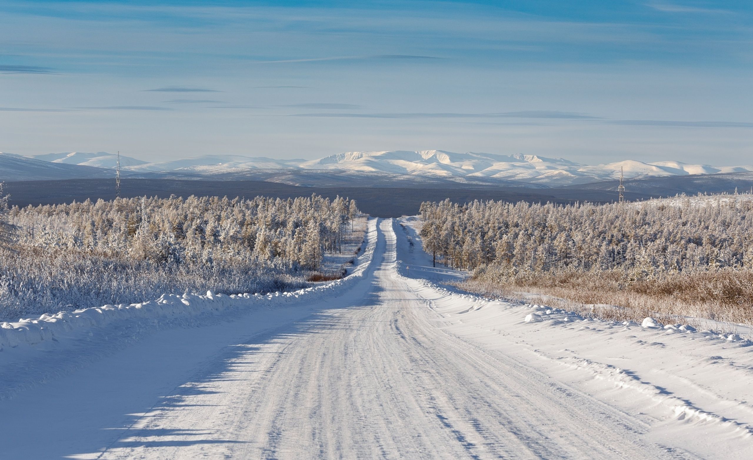 Winter,Road,Going,Down,The,Slope,Of,The,Hill,Against