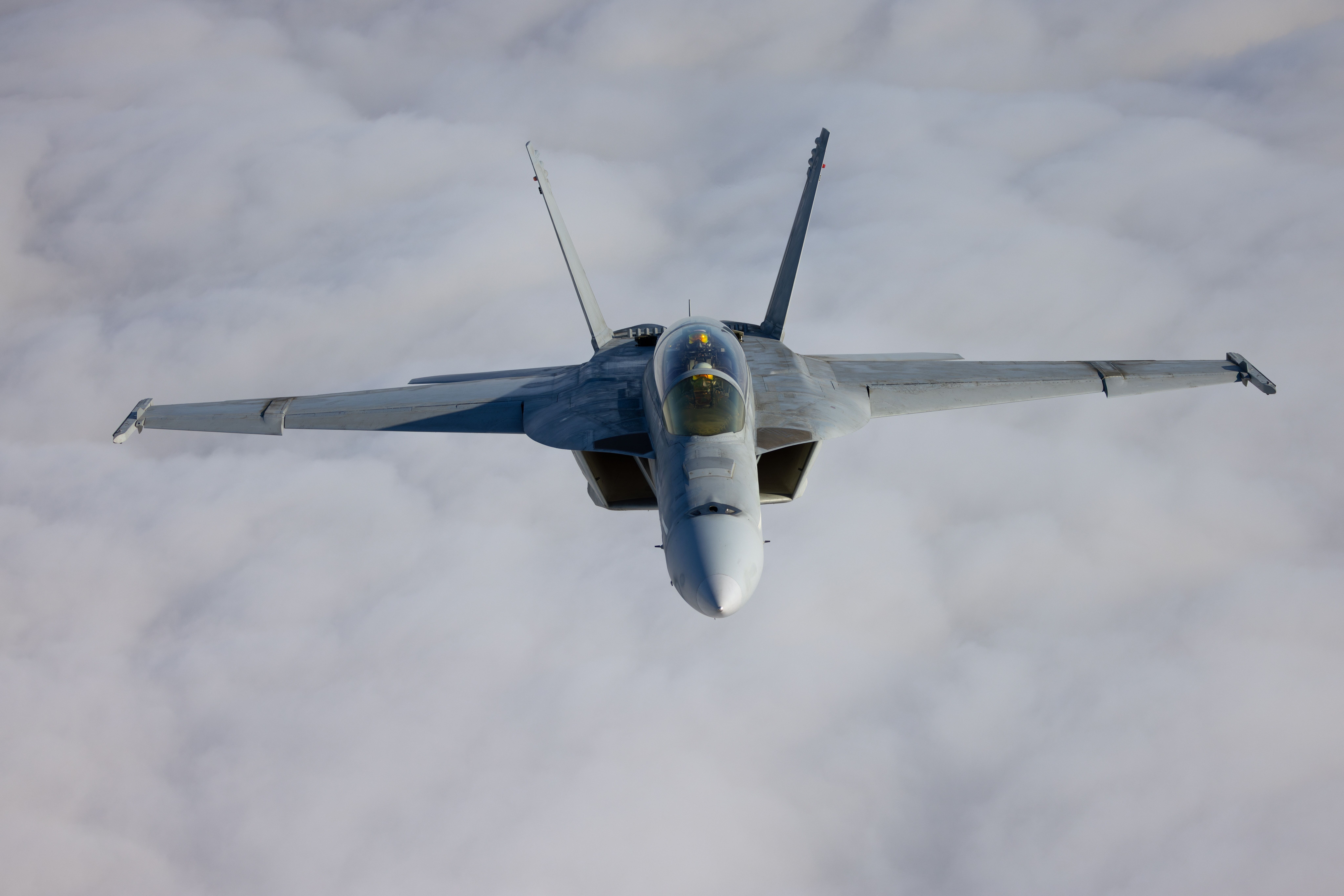 Frontal,View,Of,A,Fa-18f,Super,Hornet,Over,Clouds