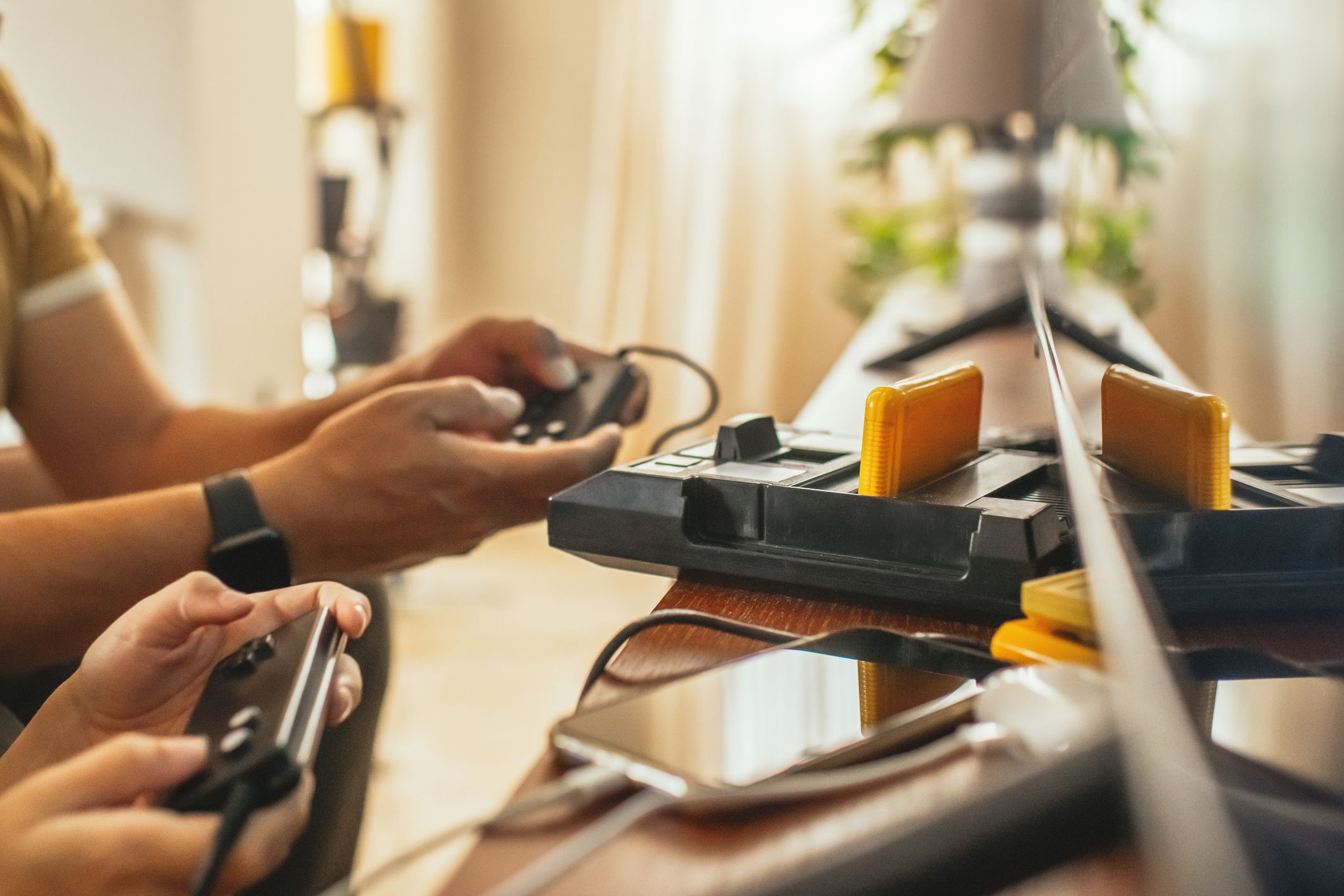 Boy and his father with retro video game console