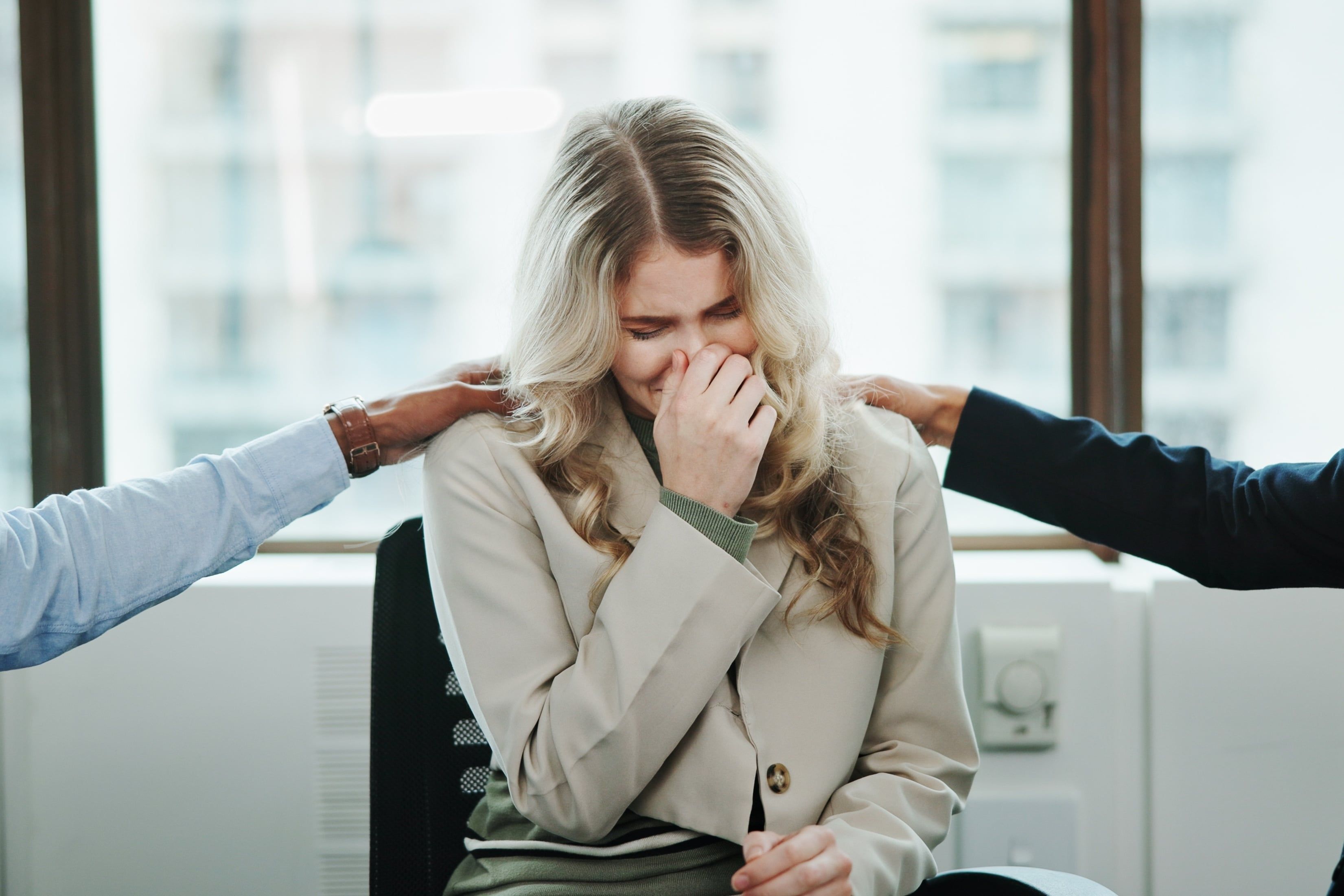 Sad,Woman,,Meeting,And,Support,Group,With,Team,At,Office