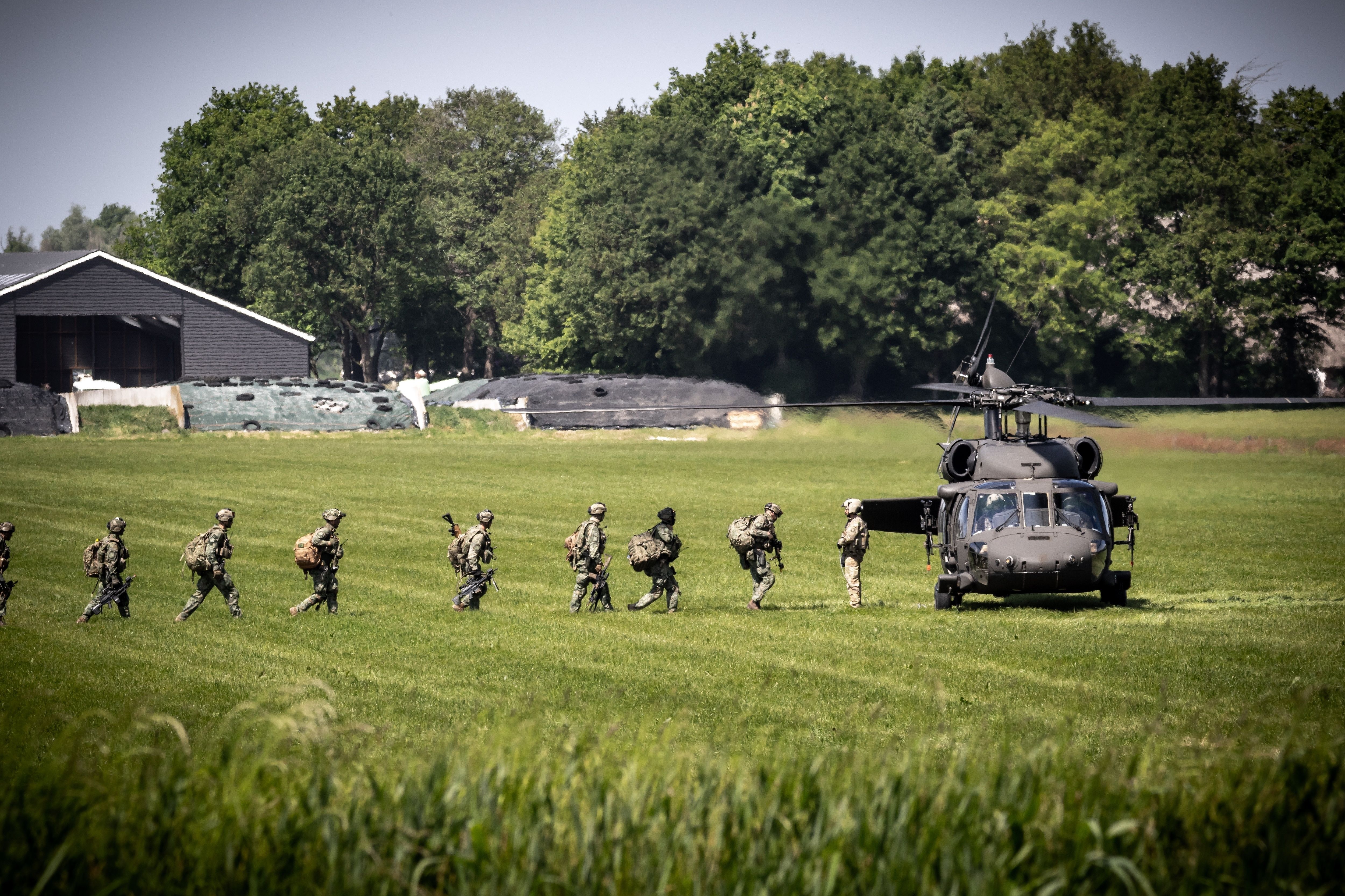 Nato,Troops,Walking,To,A,Us,Army,Uh-60,Blackhawk,Helicopter