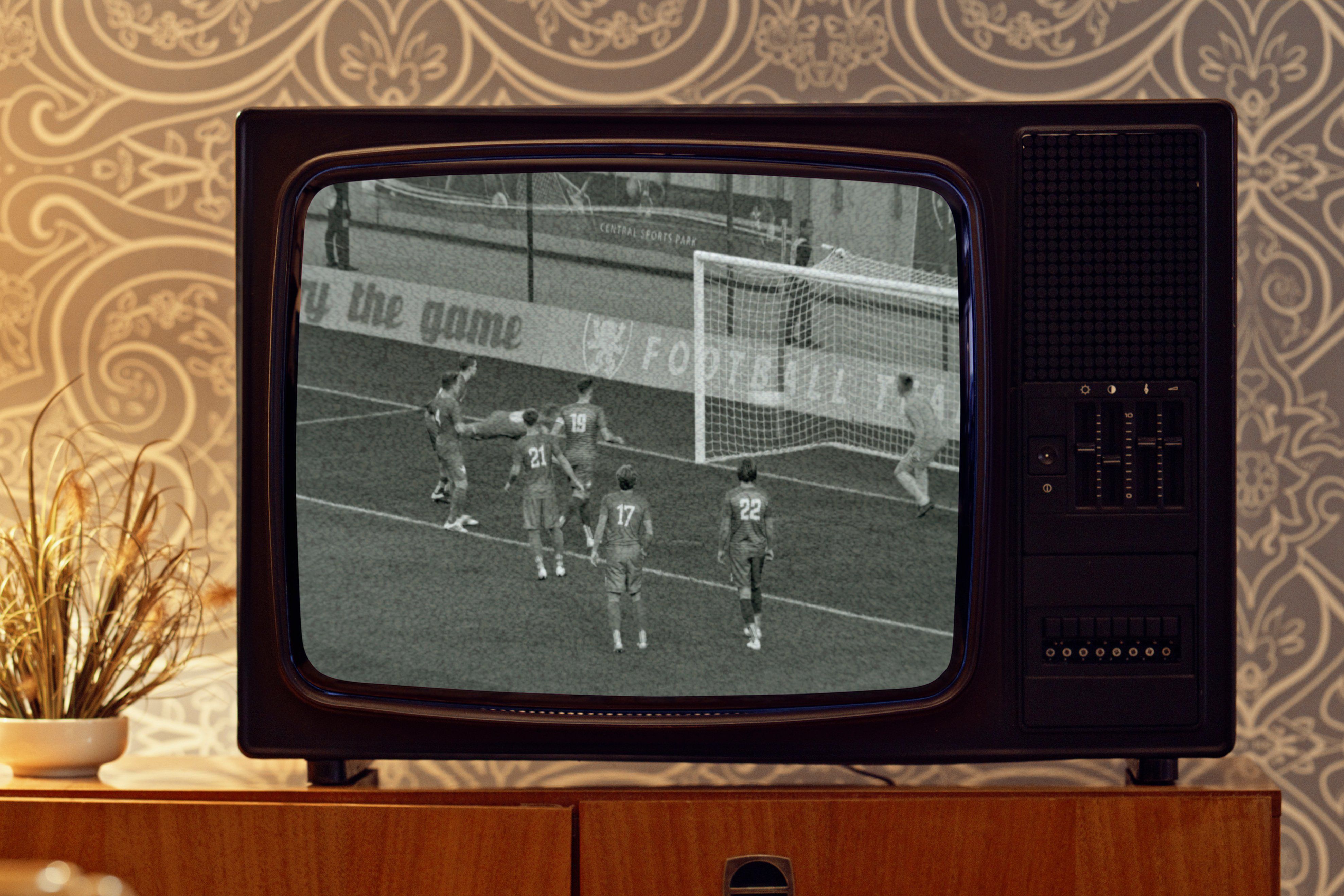 Retro Football Game Broadcast on CRT Television in Vintage Living Room Setting