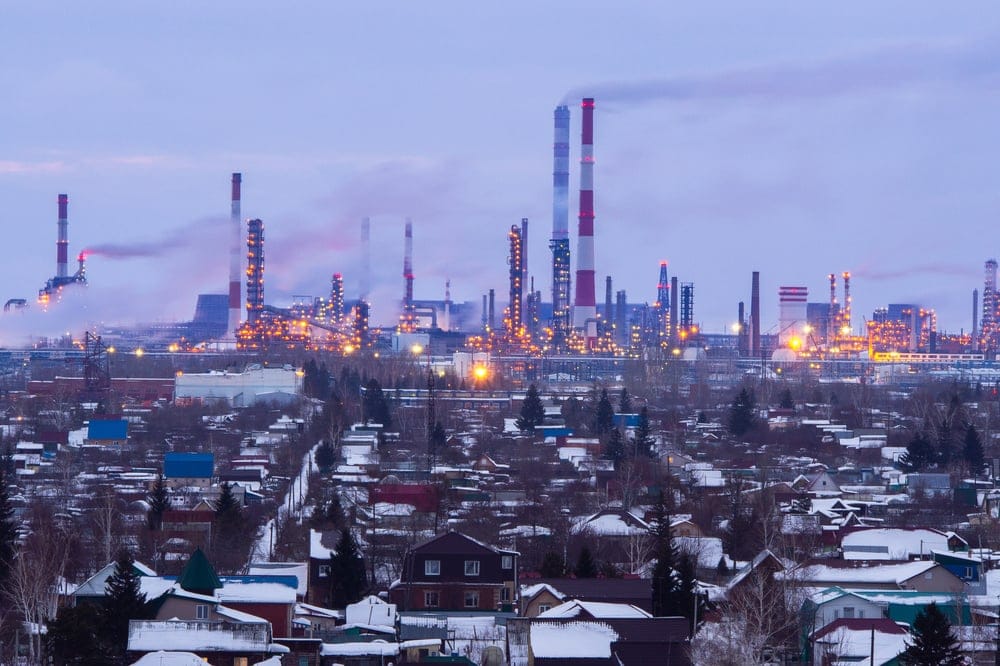 Omsk,Oil,Refinery,At,Sunset,With,Luminous,Lights.,High,Pipe