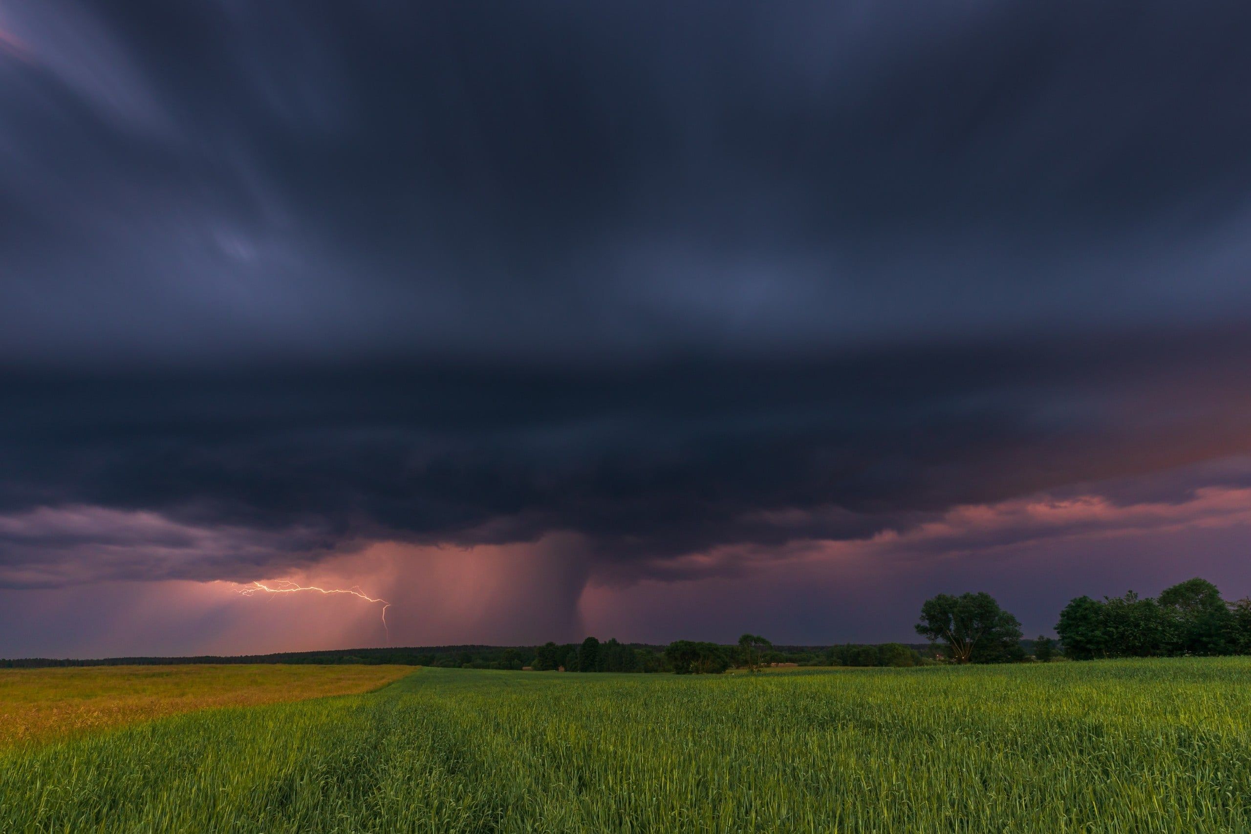 Dramatic,Thunderstorm,With,Visible,Lightning,And,Dark,Clouds,Over,Green