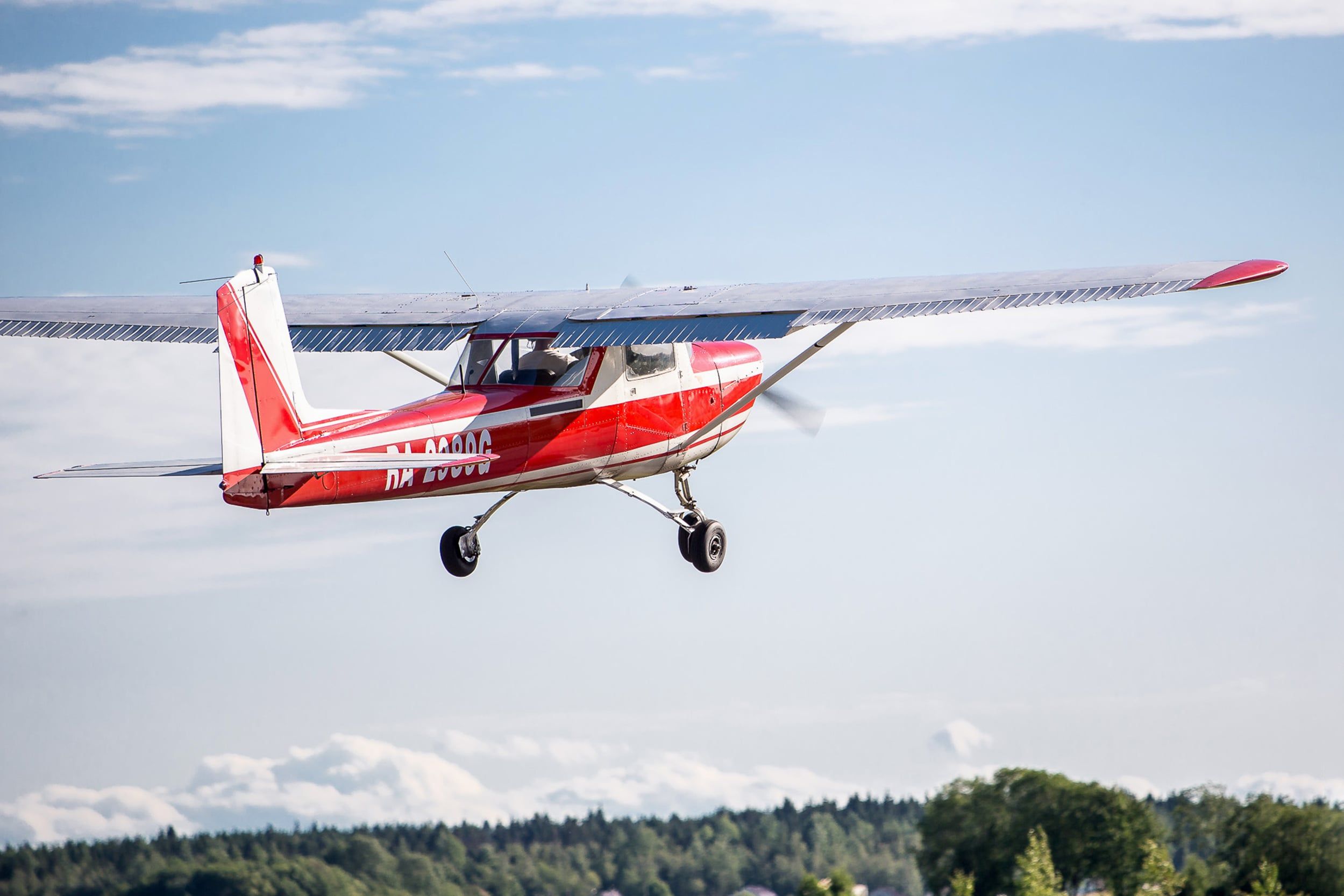 A,Red,Cessna,150,Takes,Off,From,The,Runway