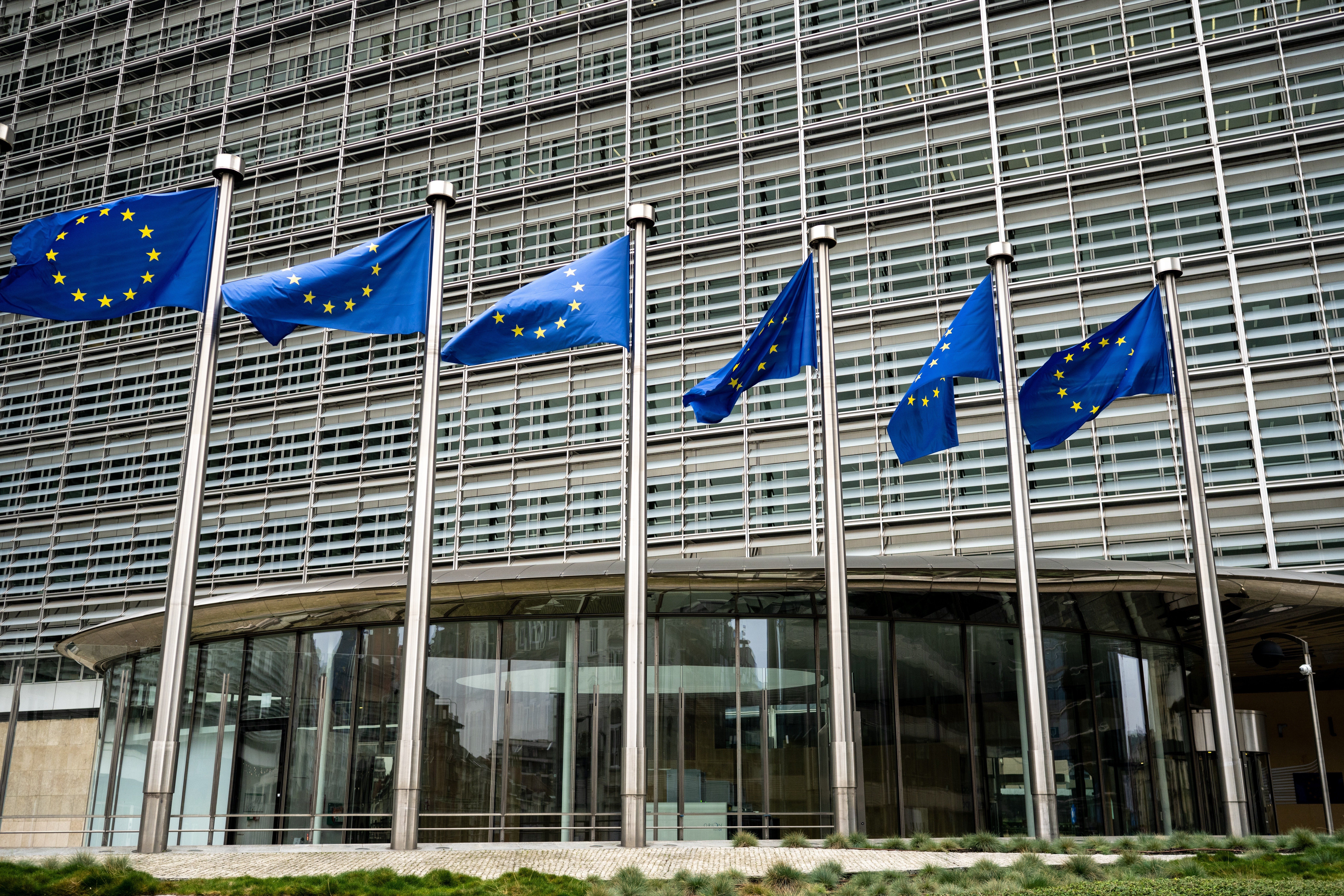 Eu,Flags,Against,European,Commission,Building,Background,In,Brussels,Belgium