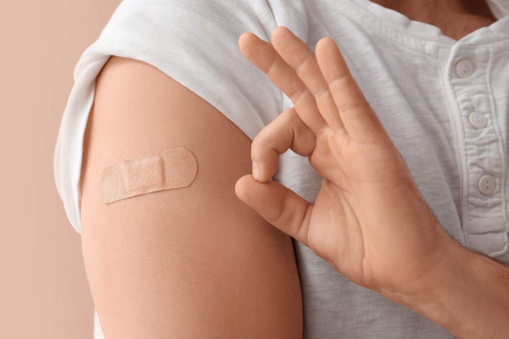 Young,Man,With,Applied,Medical,Patch,On,His,Arm,Showing