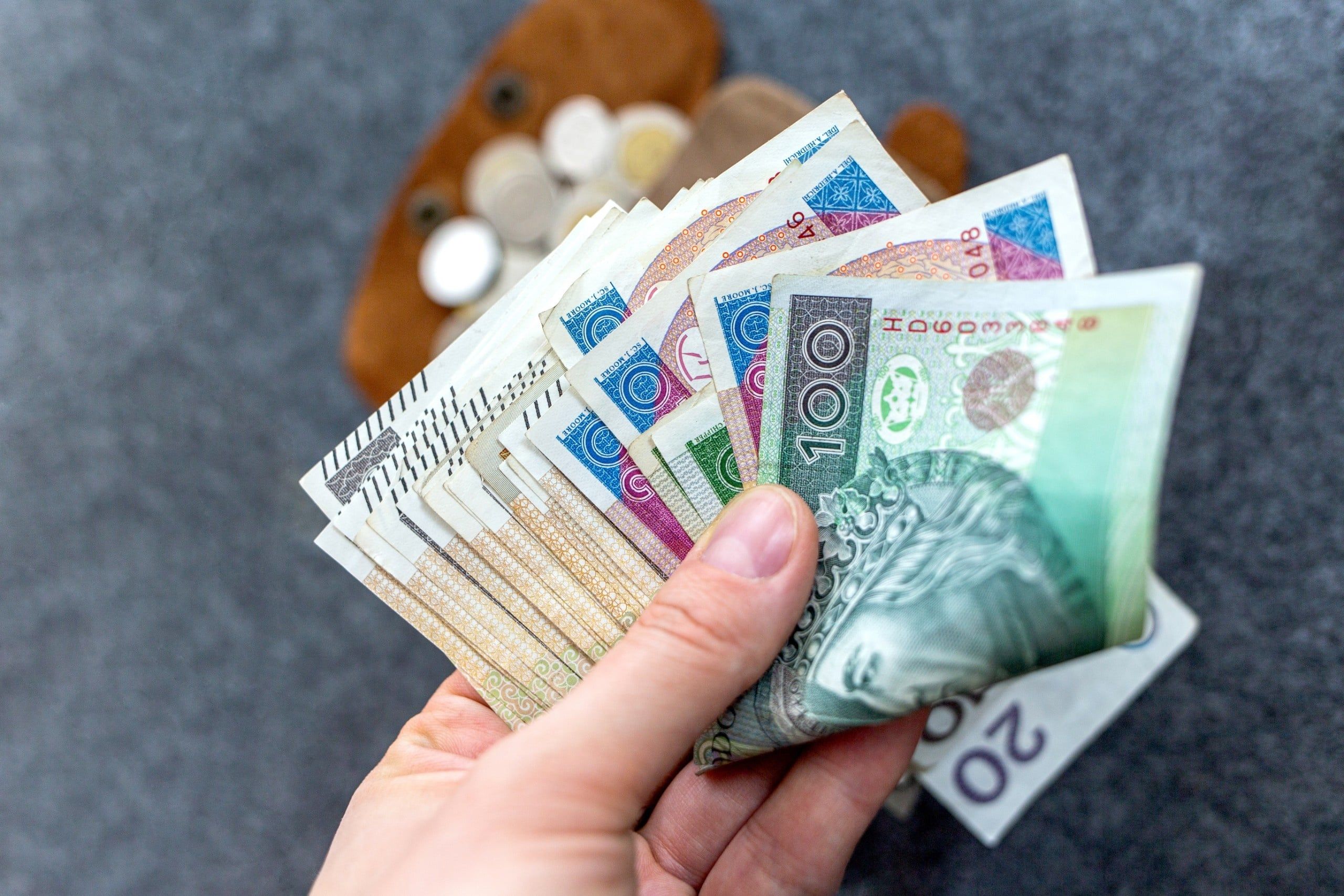 Close-up,Of,A,Hand,Holding,A,Fanned-out,Stack,Of,Polish