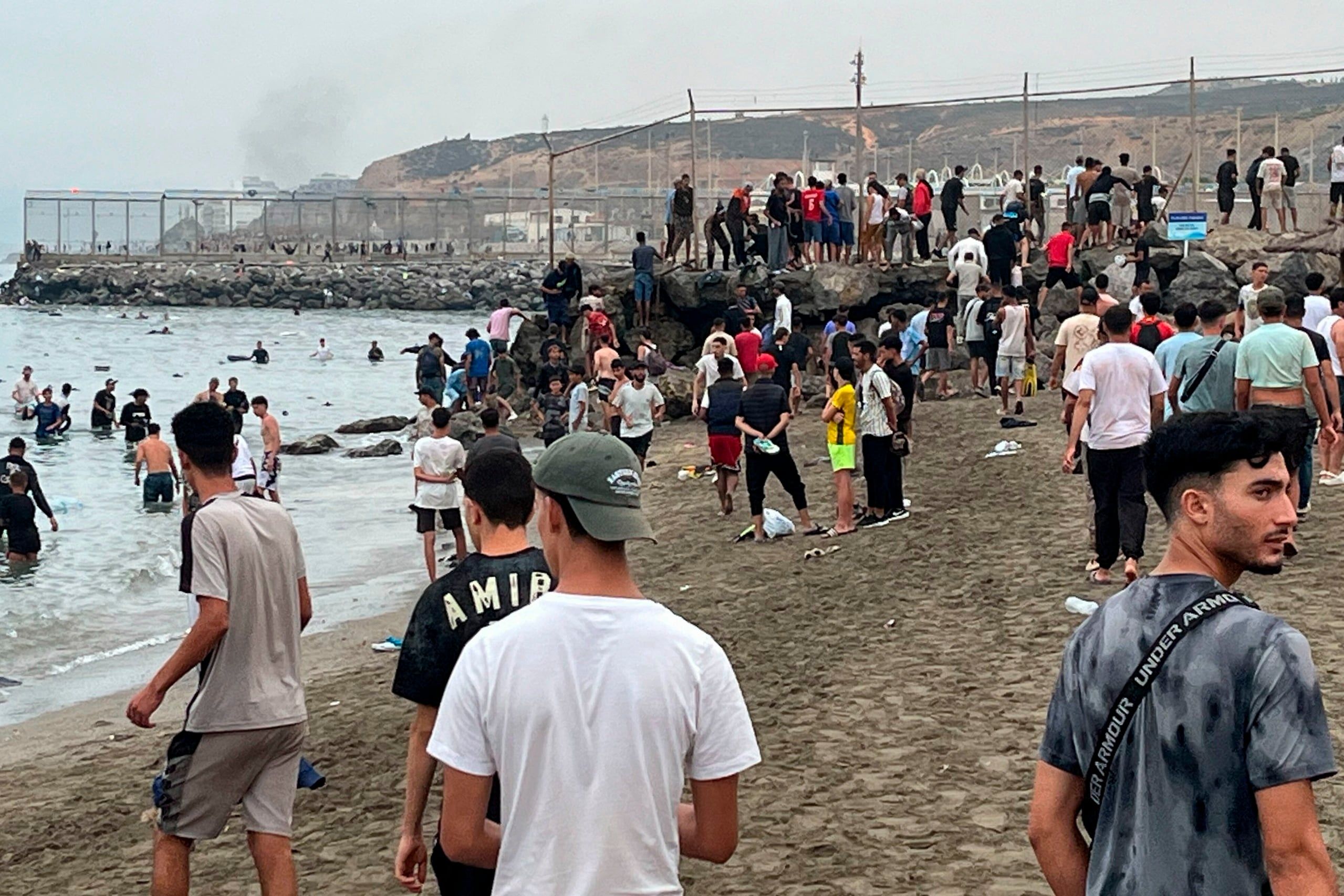 Thousands of migrants enter Spanish enclaves in North Africa