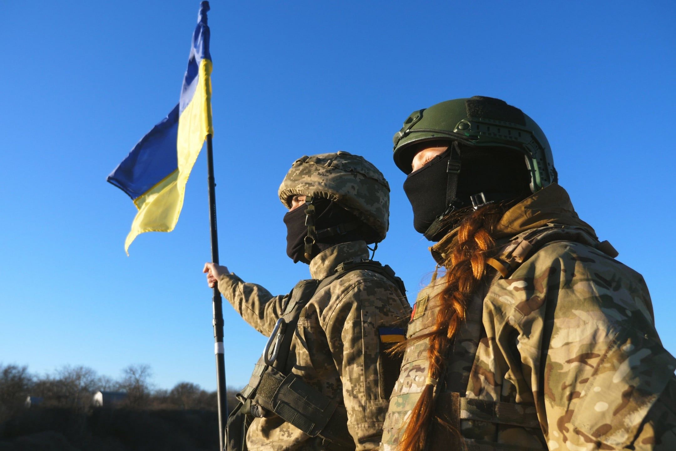 Woman,And,Man,In,Camouflage,Uniform,Looking,At,Distance,With