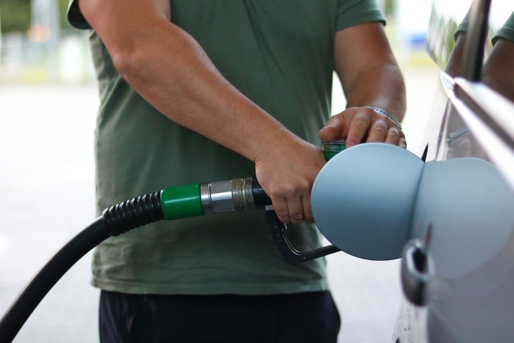 A,Person,Filling,A,Car,With,Fuel,At,A,Gas