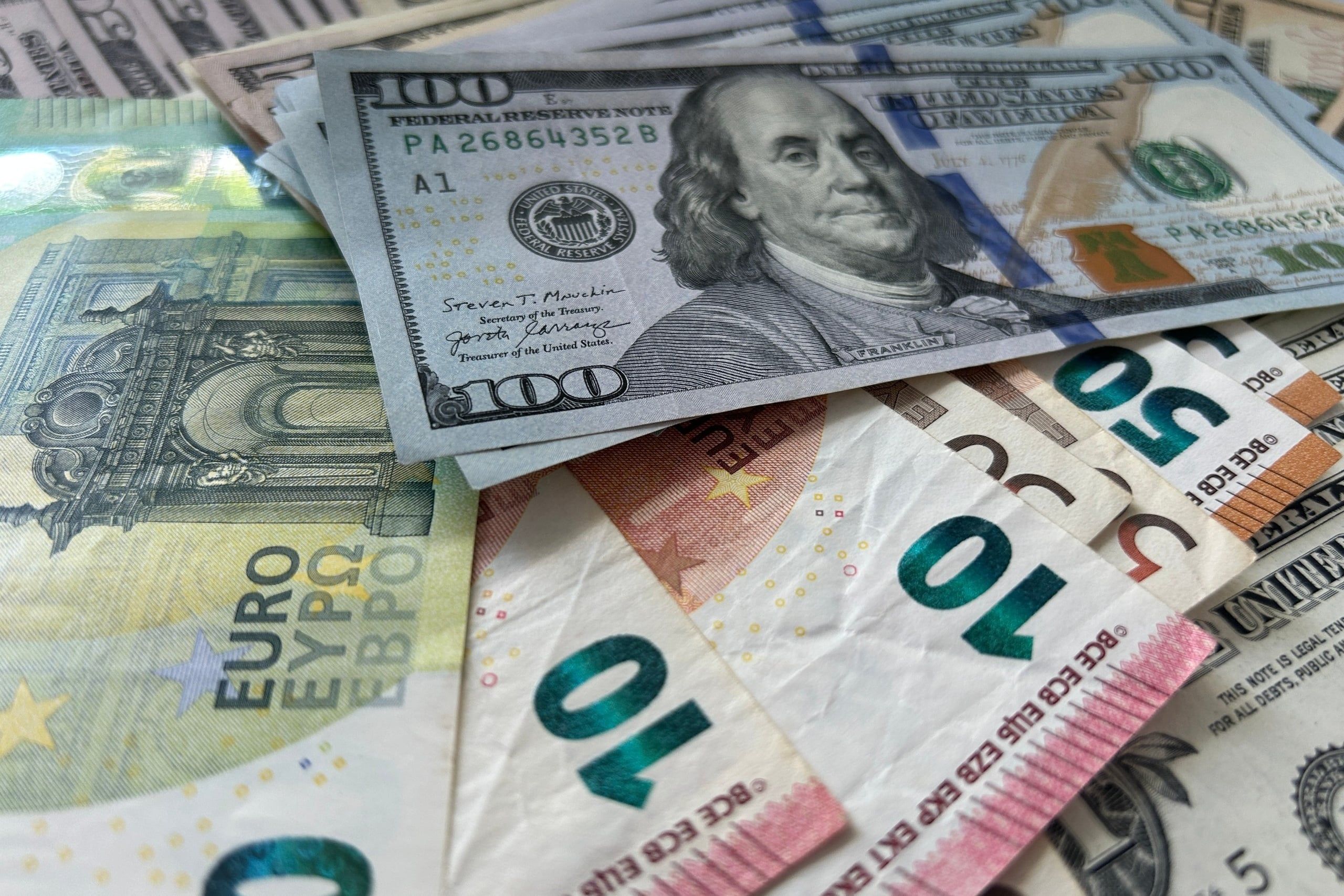 Dollar,And,Euro,Bills.,Close-up,Footage,Of,Us,Dollar,And