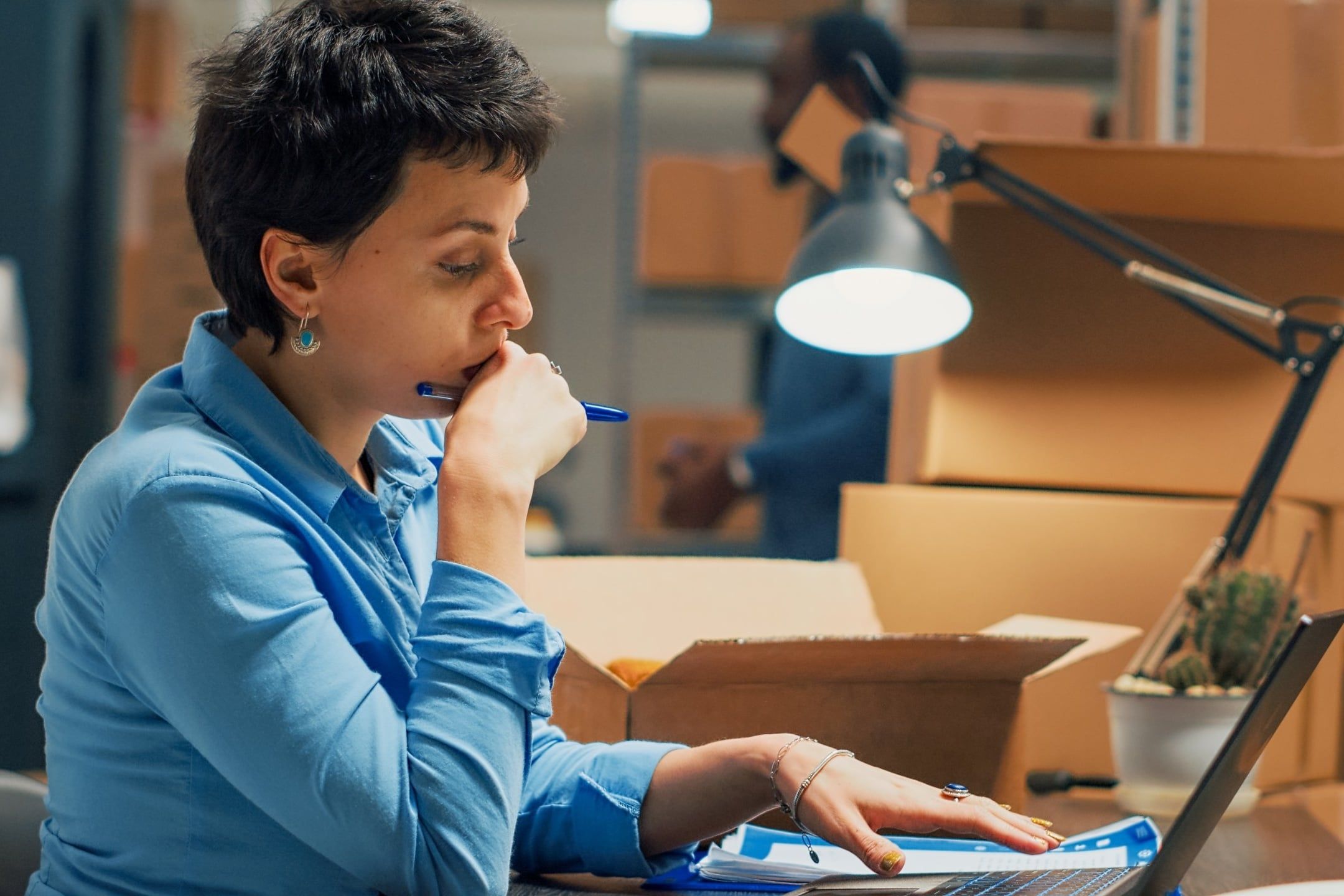 Young,Person,Working,On,Shipping,Products,From,Warehouse,Shelves,,Using