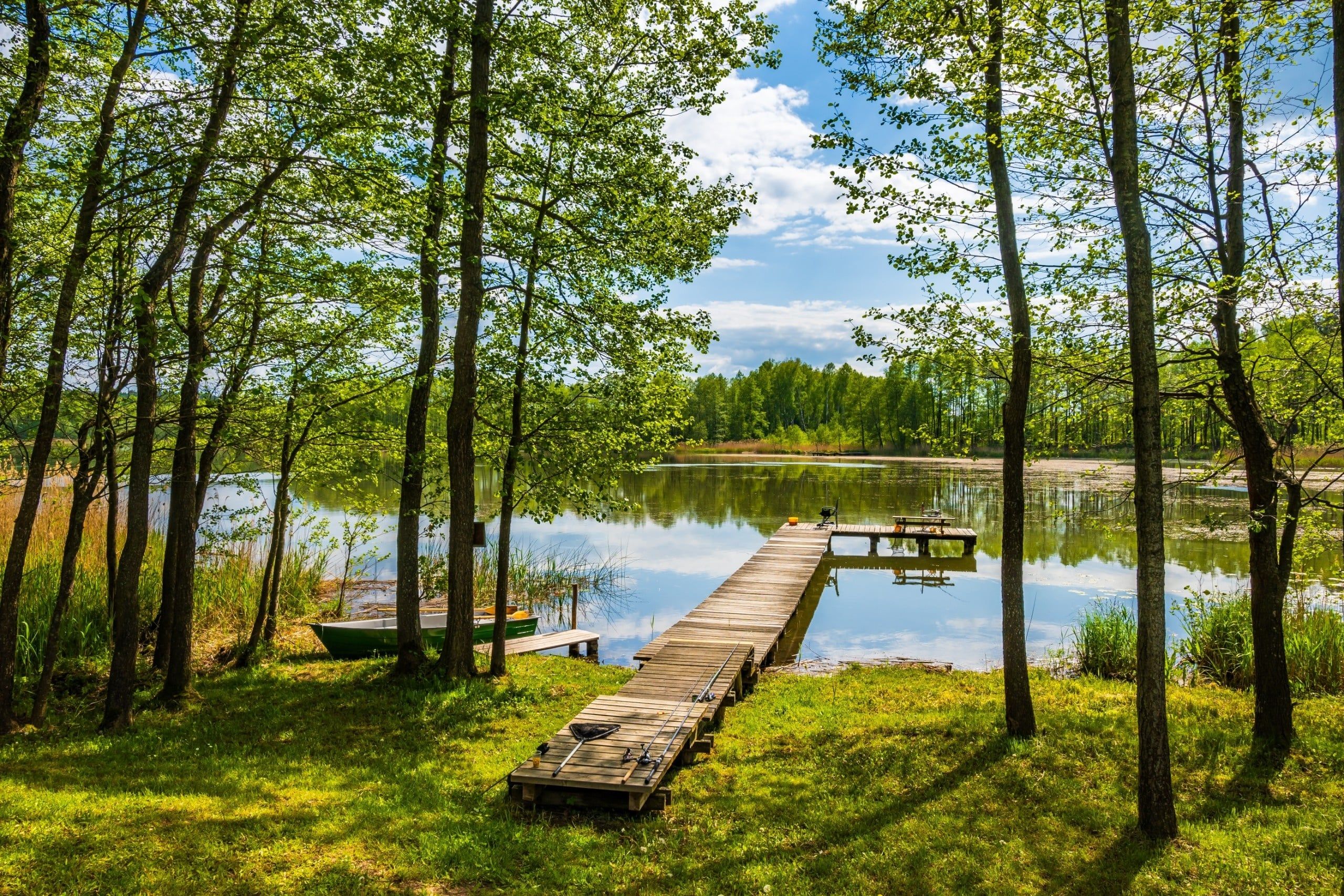 Wooden,Pier,At,Beautiful,Lake,During,Sunny,Summer,Day,,Suwalski