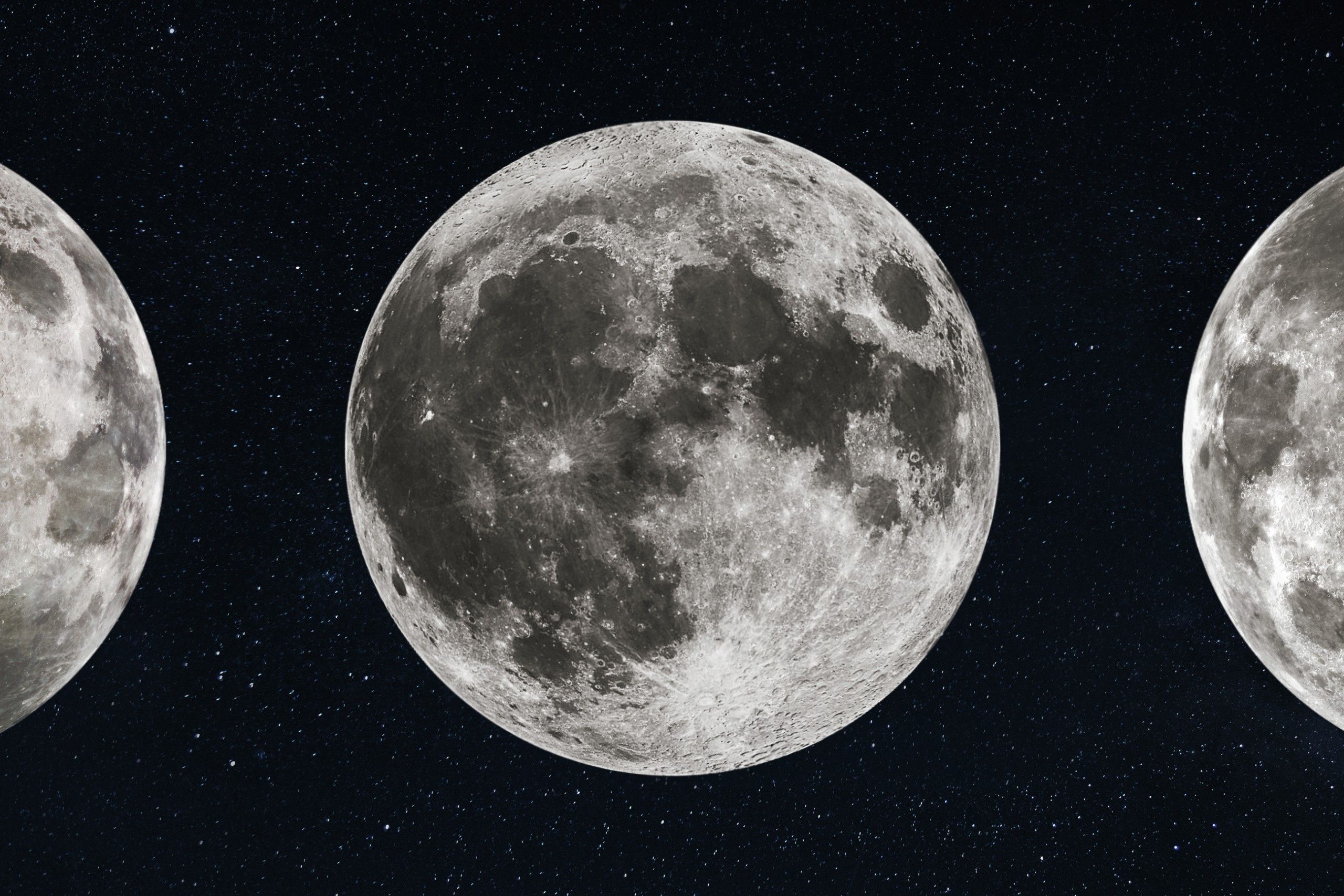 Detailed,Close-up,Of,A,Full,Moon,Centered,Between,Two,Partial