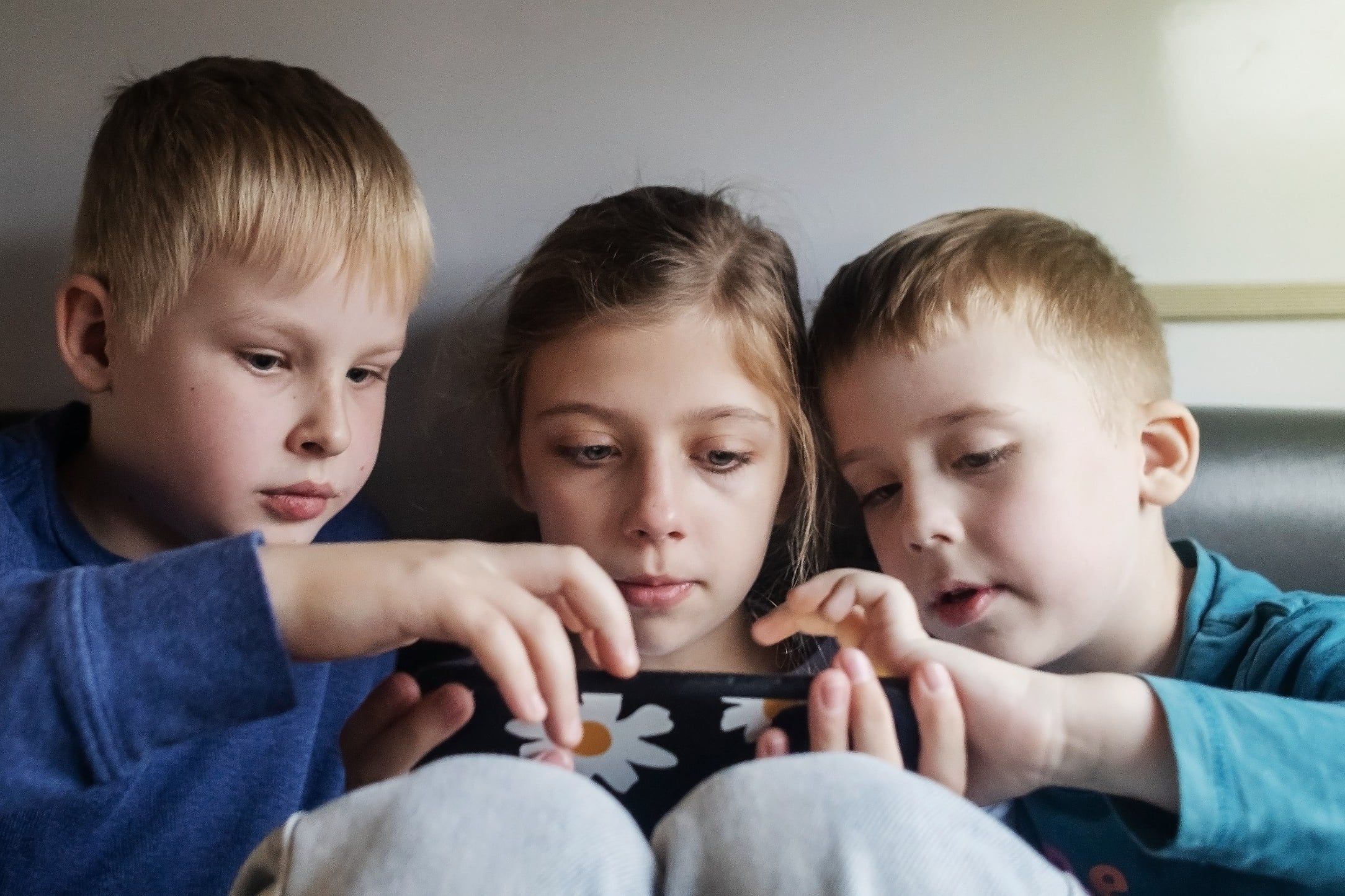 Children,And,The,Phone.,Children's,Addiction,To,Gadgets.,Three,Children