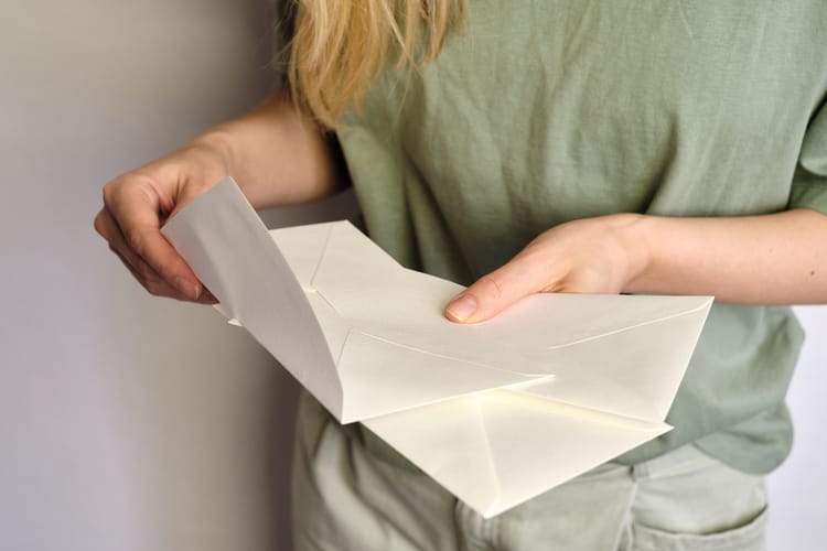 Woman,Holds,In,Hand,Paper,Envelope.,New,Mail,,Message.,Postal