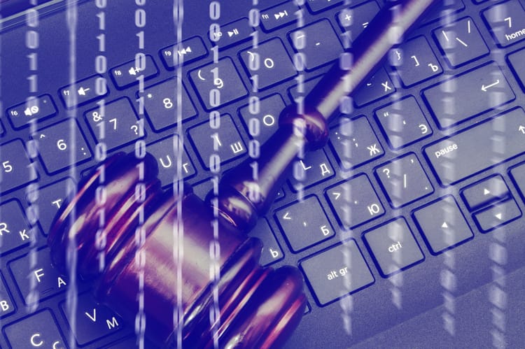 Cyber,Law,Concept,,Wooden,Judge,Gavel,On,Laptop,Computer,Keyboard