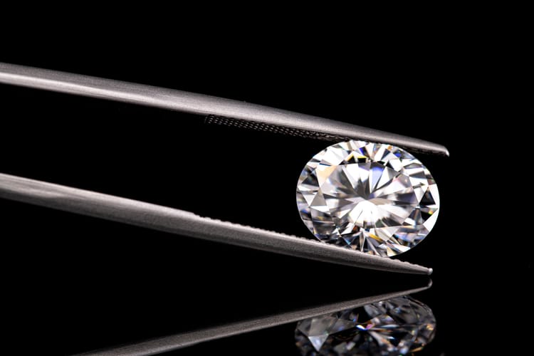 A,Diamond,Is,Displayed,In,A,Diamond,Setting.,The,Diamond