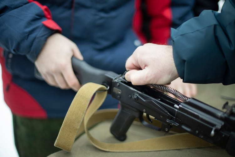 Children,Learn,To,Shoot,In,Russia.,Assembly,Of,Automatic,Weapons.