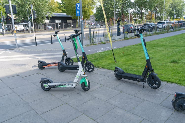 August,26,,2023,-,Warsaw,,Poland:,Many,Parked,Electric,Scooters