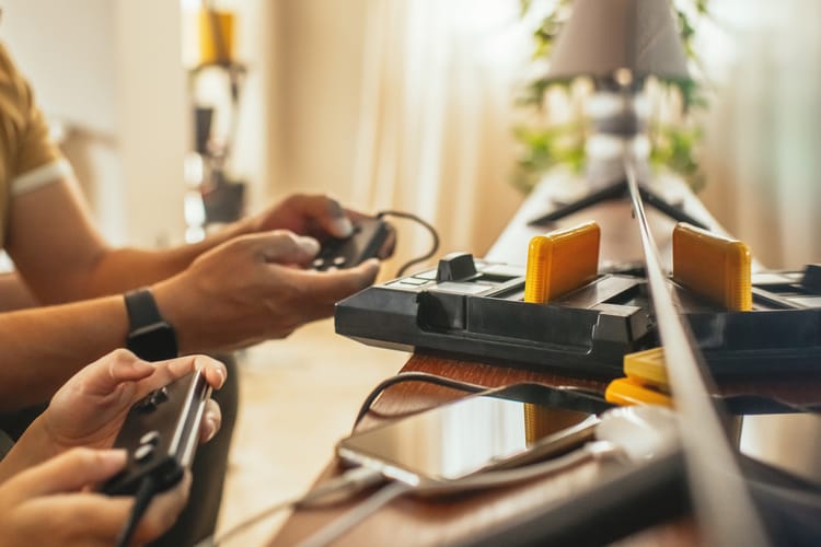 Boy and his father with retro video game console