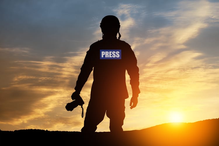 Photojournalist,Silhouette,Documenting,War,Or,Conflict.,Photojournalist,At,Sunset.,War,