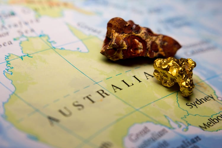 Close-up,Of,Bauxite,Mineral,And,Gold,Nugget,On,Top,Of