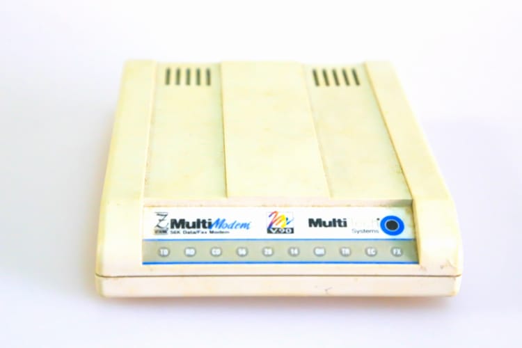 Old useless 56k modem with white background.
